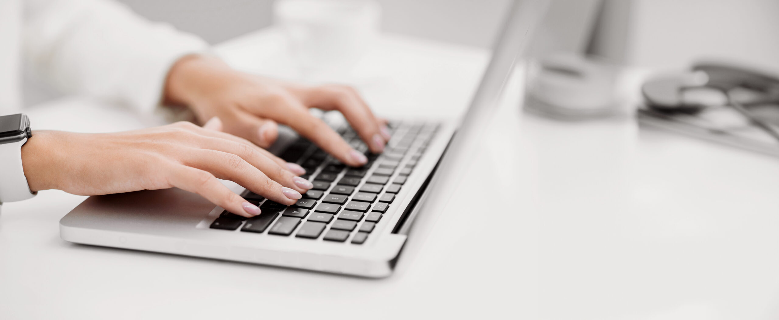 cropped-image-of-manager-using-her-laptop-computer